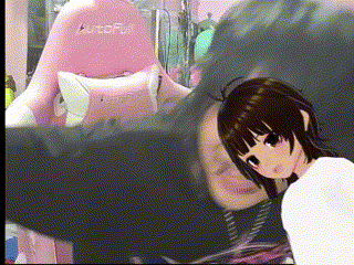 a girl is standing next to a man in a room with a pink chair in the background .