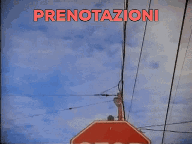 a stop sign with the word prenotazioni written above it