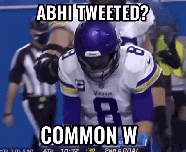 a football player with a purple helmet and the number 8 on his jersey