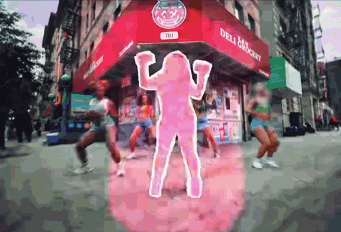 a group of women are dancing in front of a store called deli grocery