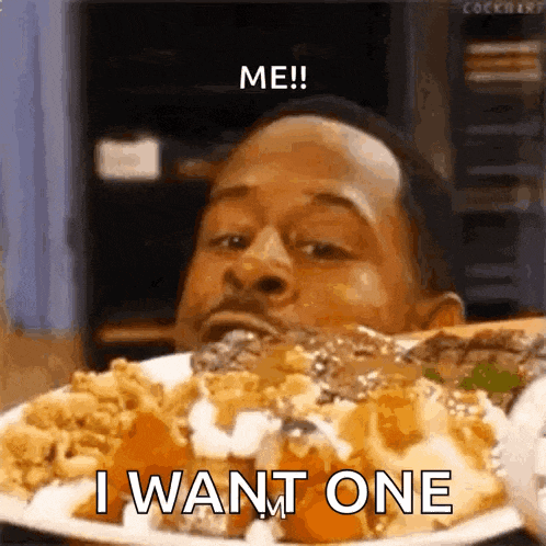 a man is eating a plate of food with the words `` me ! i want one '' written on it .