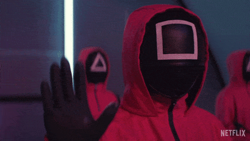 a person wearing a red hooded jacket with netflix written on the bottom right corner