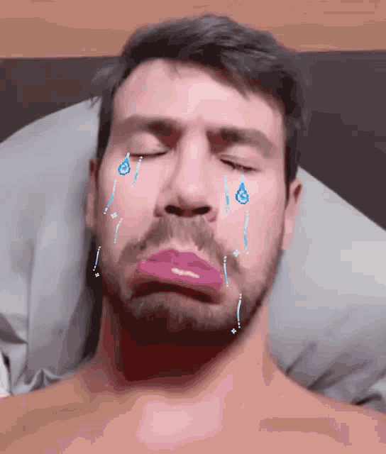 a man with a beard and pink lipstick on his lips is crying