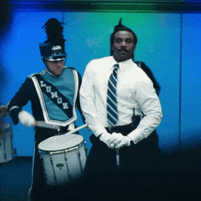 a man in a marching band uniform has the letters lm on it