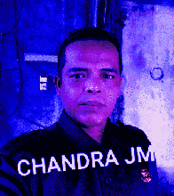 a man in a black shirt with the name chandra jm on it