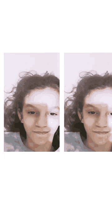 a young boy with curly hair is smiling and looking at the camera