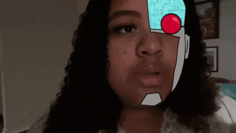 a young woman with a robot face painted on her face .