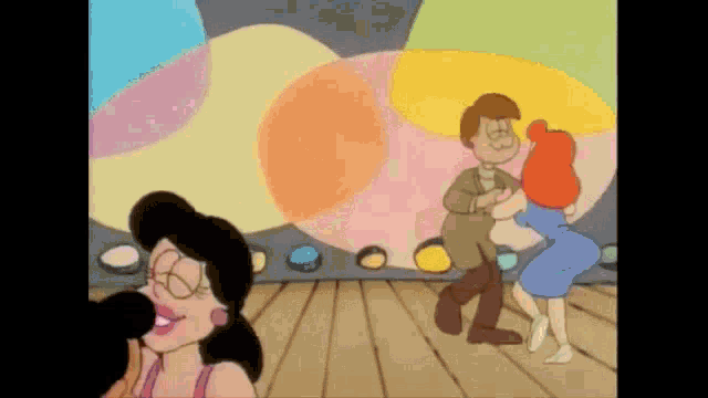 a couple of cartoon characters are dancing in a room with a colorful background .
