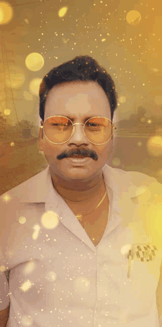 a man with a mustache wearing sunglasses and a white shirt stands in front of a yellow background