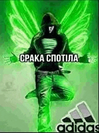 a man with wings is jumping in the air in front of a green background .