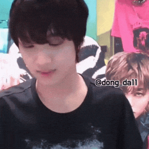 a close up of a person 's face with the name dong_da11 written on the bottom
