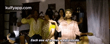 a group of people are dancing in a living room with the words `` each one of us has a kall inside '' .