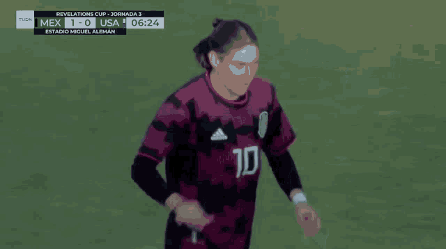a soccer player wearing a number 1 jersey is giving a thumbs up