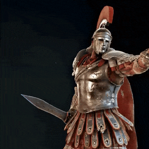 a statue of a man in armor holding a sword