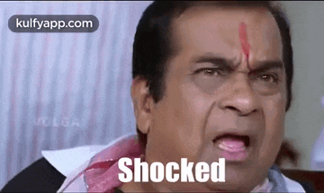 a man is making a shocked face with his mouth open .