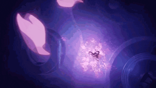 a person is holding a purple object with a scorpion on it .