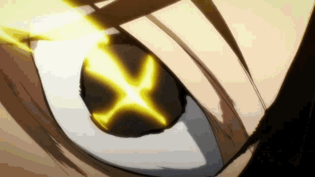 a close up of a person 's eye with a glowing x in it