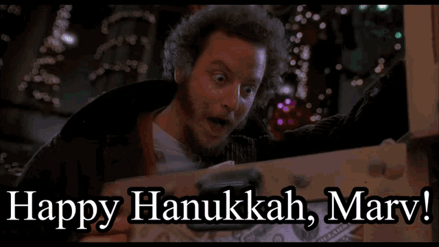 a picture of a man with the words happy hanukkah marv below him