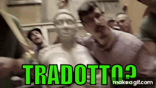 a group of people are standing around a statue of a woman with the words `` tradotto ? '' written on it .