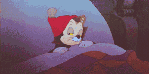 a cartoon cat wearing a red hat laying in bed