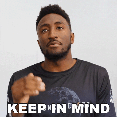 a man wearing a shirt that says " keep in mind "