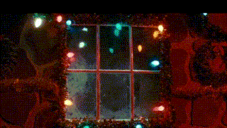 a window with christmas lights hanging from it