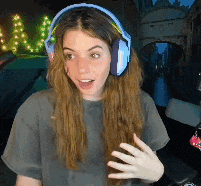 a woman wearing headphones and a gray shirt