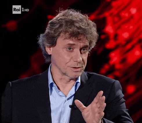 a man in a suit and blue shirt is talking on rai 1 hd