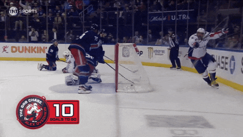 a hockey game is underway and the score is 10