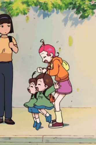 a girl in an orange hoodie is standing next to two other girls