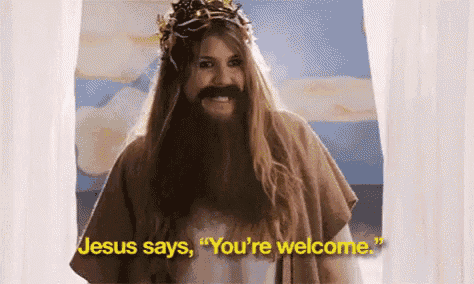 a woman with long hair and a beard is dressed as jesus and says jesus says you 're welcome