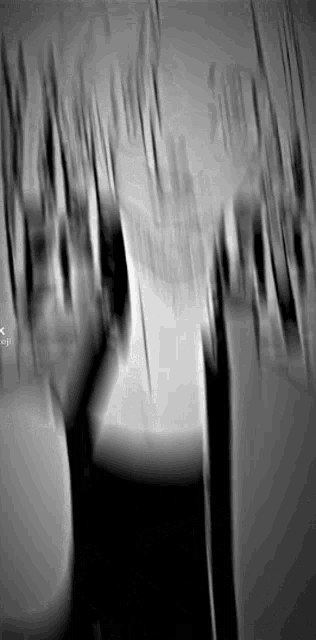 it is a black and white photo of a person 's hands .