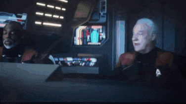 two men sitting in front of a monitor with the words " i hope we die quickly " on the bottom