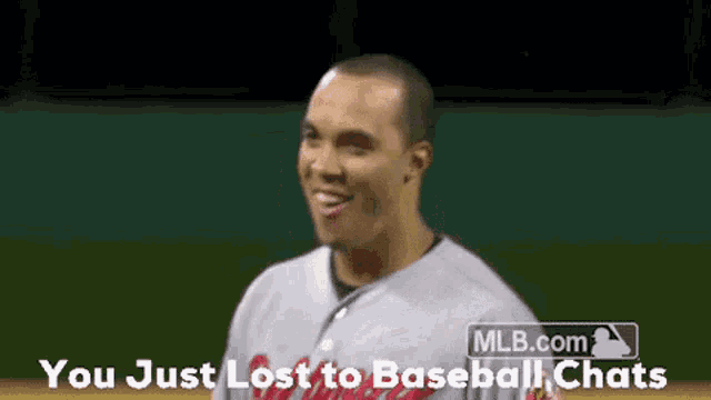 a man in a baseball uniform is smiling with the words you just lost to baseball chats below him