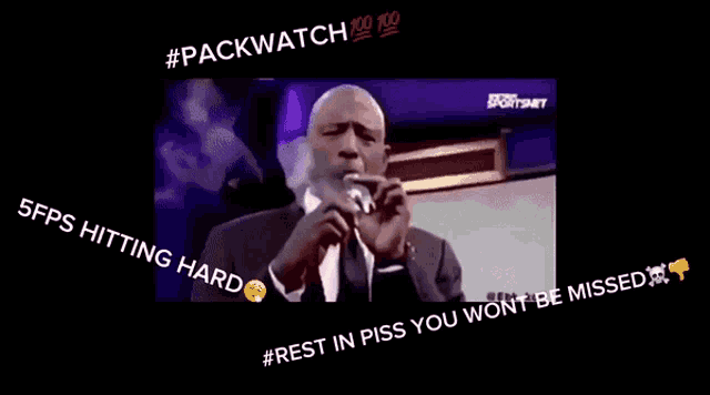 a man in a suit and tie is smoking a cigar with the caption #packwatch