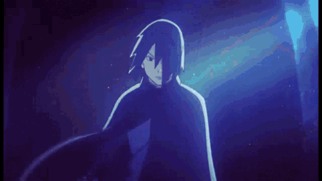 a man in a black cape is standing in a dark room in front of a blue light .