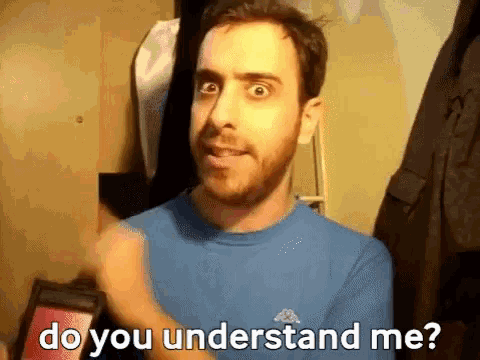 a man with a beard wearing a blue shirt is asking do you understand me