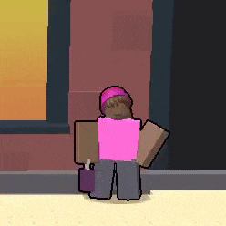 a girl in a pink shirt is standing in front of a building .