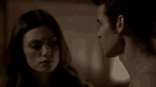 a man and a woman looking at each other