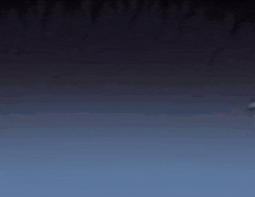 a close up of a cartoon character 's face in a dark room with a blue background .