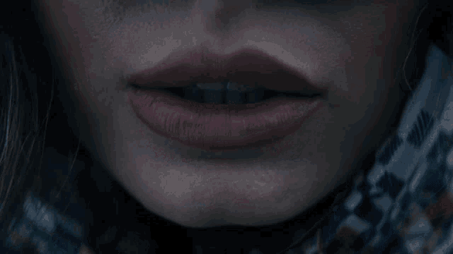 a close up of a woman 's lips with red lipstick on
