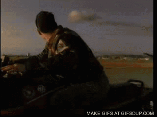 a man is riding a motorcycle with a make gifs at gifsoup.com watermark on the bottom