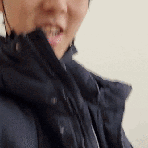 a close up of a person wearing a helmet and a black jacket