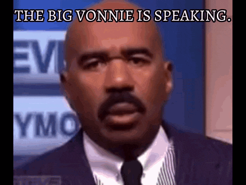 a bald man in a suit and tie with the words " the big vonne is speaking " below him