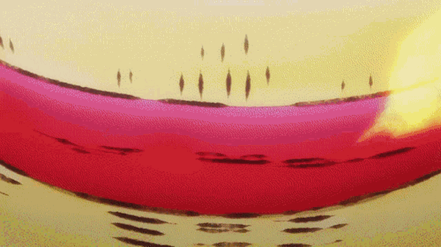 a close up of a red and yellow object with a few dots on it