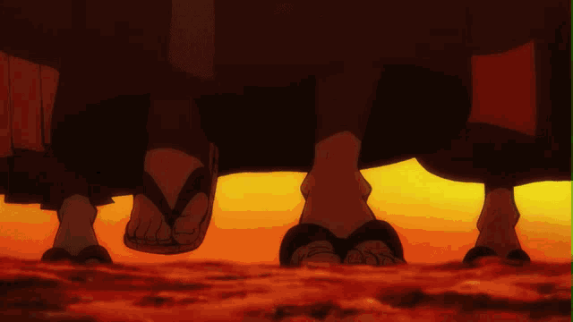 a couple of people standing next to each other wearing flip flops in front of a sunset