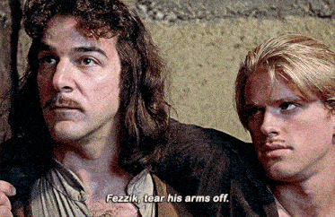 two men are standing next to each other and one of them is saying " fezzik tear his arms off "