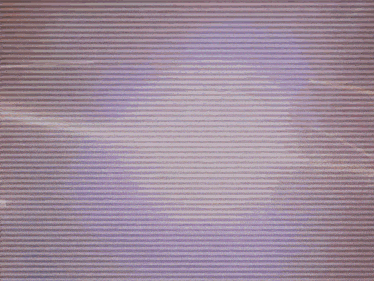 a blurry picture of a person in a dark room with a purple background
