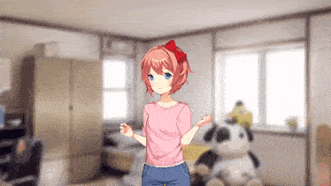 a girl in a pink shirt is standing in a room with a stuffed animal .