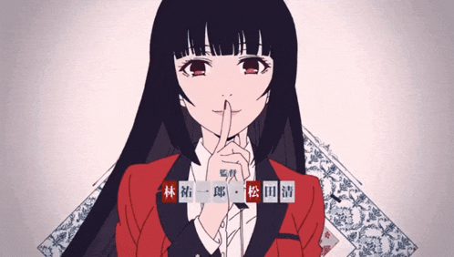 a girl with long black hair holds her finger to her mouth